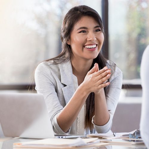 Cheerful buisnesswoman meets with colleague