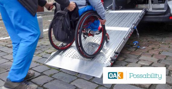 Disabled person on wheelchair using car lift