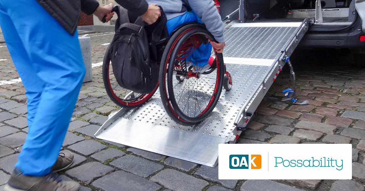 Disabled person on wheelchair using car lift