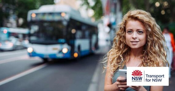 Woman using mobile app on bus stop