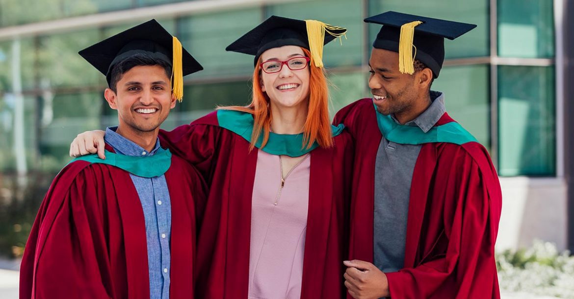 Three college graduates