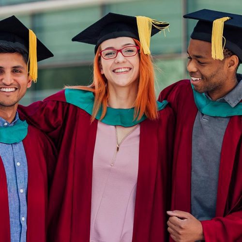 Three college graduates