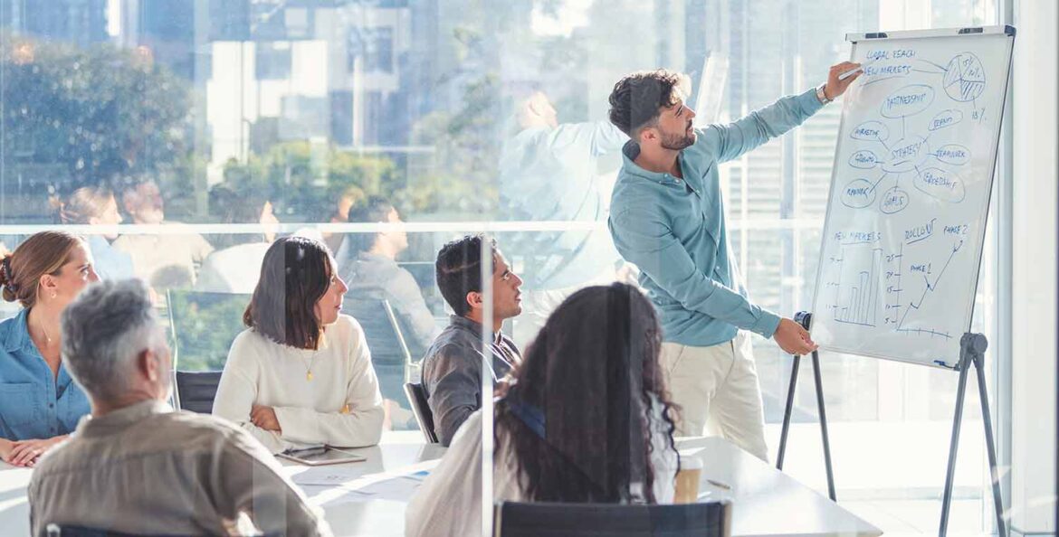 Business people watching a presentation on the whiteboard