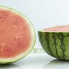 Watermelon cut in half on a table top