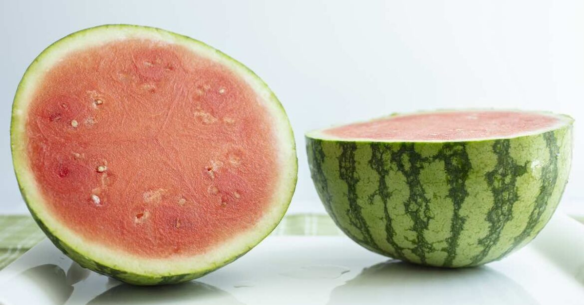 Watermelon cut in half on a table top