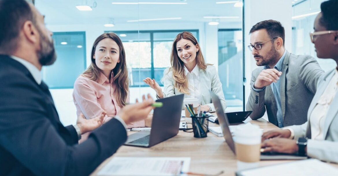 Professionals negotiating with one another in a meeting room